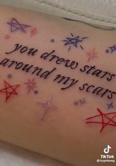 a woman's arm with an inscription on it that says, you dreee stars around my scars