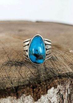 Sterling silver and turquoise with a hand fabricated fan detailing on band. Size: 8 Turquoise Rings With Polished Finish, Southwestern Blue Turquoise Teardrop Ring, Blue Sterling Silver Rings With Patina, Blue Sterling Silver Ring With Patina, Handmade Blue Turquoise Teardrop Ring, Handmade Turquoise Teardrop Ring, Handmade Teardrop Turquoise Ring, Southwestern Blue Teardrop Ring, Southwestern Teardrop Blue Rings