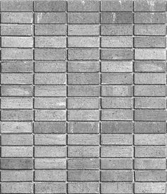 a black and white photo of a wall made out of small blocks of concrete bricks