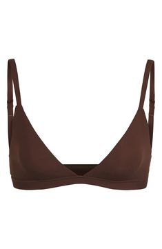 Enjoy the comfort of a bralette while retaining the breathability of quick-dry fabric with this comfortable option from Kim Kardashian West's SKIMS. Available in nine different shades, this second-skin triangle bra offers natural support and comfort while you read, lounge and sleep. Adjustable straps Quick-dry, max-stretch technology Lined 76% polyamide, 24% elastane Hand wash, dry flat Imported Lingerie Solid Color Low-cut Seamless Bra, Solid Color Seamless Low-cut Bra, Minimal Stretch No-show Bra, Fitted Seamless Nursing Bra No-show, Fitted Seamless Nursing Bra, Solid Seamless Low-cut Nursing Bra, Solid Color No-show Bra With Minimal Stretch, Everyday Fitted Seamless Nursing Bra, Fitted Sports Bra With Removable Pads For Everyday