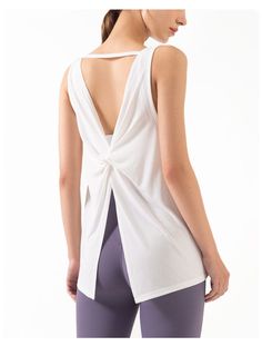 The EMES SHOP tank top is detailed with a scoop neckline. and thick tank straps that connect in an open triangle back. Features a twist detail mid-back. and flares out to an open split that can be tied and falls below the hips. This light-weight. super breathable tank is perfect for laying over sports bras for a run. workout. hike. yoga. or even simply every day wear.MATERIAL: 70% Modal. 30% PolyesterMEASUREMENTS: Small | Bust: 41" cm . Length: 60" cm Medium | Bust: 43" cm . Length: 62" cm Large | Bust: 45" cm . Length: 64" cm XL | Bust: 47" cm . Length: 66" cm MEASUREMENTS: Small | Bust: 16.14" in . Length: 23.6" in Medium | Bust: 16.9" in . Length: 24.4" in Large | Bust: 17.7" in . Length: 25.2" in XL | Bust: 18.5" in . Length: 26" in Chic Sleeveless Cutout Back Tank Top, Chic Sleeveless Tank Top With Cutout Back, Sleeveless Summer Tops With Cutout Back, Sleeveless Tops With Cutout Back For Summer, Summer Cross Back Tank Top With Tie Back, Summer Tank Top With Tie Back And Cross Back, Summer Tank Top With Tie And Cross Back, Backless Workout Tops With Built-in Bra, White Cross Back Tank Top For Summer