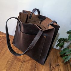 Enjoy the luxury and quality of our Italian leather laptop bag. Crafted from the highest quality leather, it offers elegance and durability perfect for any professional or personal situation. For dedicated teachers, our leather briefcase is the perfect choice. With multiple compartments and a spacious interior, it provides space for all study materials, a laptop and personal belongings, combining style and practicality. Give your grandma something really special with our personalized leather tot Leather Laptop Tote Bag With Large Capacity, Leather Tote Laptop Bag Gift, Leather Tote Briefcase With Large Capacity, Large Capacity Leather Tote Briefcase, Brown Tote Laptop Bag For Gift, Brown Tote Laptop Bag Gift, Personalized Leather Tote Bag, Handmade Leather Tote Bag, Handmade Leather Tote