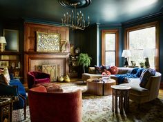 a living room filled with furniture and a fire place in the middle of a room