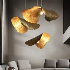 three lights hanging from the ceiling in a living room