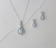 "Lovely simple Sterling silver Bridal necklace set. Created with solid sterling silver base and then plated in rose gold, yellow gold or rhodium (white gold) finish. Stones are Swarovski Pure Brilliance cubic zirconia stones. You can find more information on these stones here: https://www.swarovski-gemstones.com/brand/FAQs_Swarovski_Zirconia.en.html High quality pieces that will last you a life time ! Earrings measure 1\" Necklace measures 18 inches and extends to 20 inches Pendant measures 1.75 Rose Gold Statement Necklace, Rose Gold Jewelry Set, Rose Gold Statement Earrings, Rose Gold Earrings Wedding, Rose Gold Bridal Jewelry, Bridal Statement Necklace, Bridesmaid Jewelry Set, Wedding Earrings Chandelier, Gold Bridal Necklace