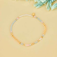 Pretty pastels with a story to tell this summer. The mixed seed bead Pineapple Crush Stretch Anklet features a patterned design of four summery shades with gold spacer seeds placed in between. String on durable nylon cord that adjusts and stretches to any size Length of anklet is 9" Because jewelry products are handcrafted by artisans, dimensions may vary from piece to piece Summer Gold Beaded Bracelets With Letter Beads, Summer Gold Bracelets With Letter Beads, Summer Gold Bracelet With Letter Beads, Gold Bracelet With Letter Beads For Summer, Casual Friendship Bracelets With Gold Beads, Casual Tiny Beads Bracelets For Spring, Casual Tiny Beads Bracelet For Spring, Casual Tiny Beaded Bracelets For Spring, Adjustable Colorful Beads Friendship Bracelets For Spring