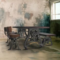 two chairs and a table in front of a wall with peeling paint on the walls