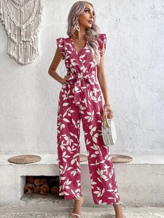 This Allover Print Ruffle Trim Belted Jumpsuit features a playful and feminine all-over print of plants, making it perfect for spring and summer. The ruffle detailing adds a flirty touch to the cap sleeves, while the wrap and belted design cinches at the high waist for a flattering silhouette. The V-neckline adds a touch of elegance to the outfit, and the non-stretch fabric offers a comfortable fit. Specifications: Pattern Type: Plants, All Over Print Details: Ruffle, Belted, Wrap Length: Long Fit Type: Regular Fit Neckline: V neck Sleeve Length: Cap Sleeve Sleeve Type: Butterfly Sleeve Waist Line: High Waist Fabric: Non-Stretch Composition: 100% Polyester Care Instructions: Machine wash or professional dry clean Belt: Yes Size Chart(cm): Size US Belt Length Bust Hip Size Inseam Length Sho Red Printed V-neck Jumpsuits And Rompers, Multicolor V-neck Jumpsuits And Rompers With Tropical Print, Red Printed V-neck Jumpsuit Or Romper, Summer Printed V-neck Jumpsuit, Red Floral Print Jumpsuit With V-neck, Belt Jumpsuit, Comfy Jumpsuits, Butterfly Sleeves, Ruffle Trim