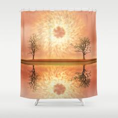 an artistic shower curtain with trees reflected in the water and sun shining through it's center