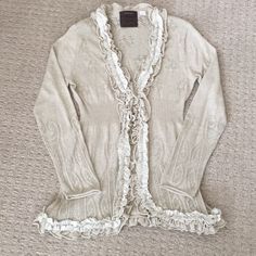 Nwot Anthropologie Guinevere Sweater. Size L. Color: Beige Sweater. See Pics For Sweater Details. Beautiful Sweater, Light Weight For Wear All Year Long. Hook And Eye Close. Removed Tags But Have Never Worn. Excellent Condition, No Pulls, Snags Or Imperfections. Sweater Length 28” Sleeve Length 18” Armpit To Armpit 17” Reasonable Offers Only Fitted Beige Sweater For Spring, Fitted Cream Sweater For Spring, Cream Fitted Sweater With Ruffles, Fitted Cream Sweater With Ruffles, Elegant Fitted Cotton Sweater, Cream Ruffled Cardigan For Fall, Beautiful Sweater, Beige Sweater, Sweater Cardigan