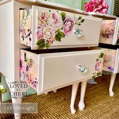 two white dressers with flowers painted on the drawers and knobs are sitting next to each other