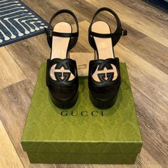 Purchased In London, Cannot Wear Due To Foot Surgery. Never Worn New In Box Authentic Guaranteed Size 8. Style Still Sold In Stores Retail $1100. 4.7" Wooden Block Heel, 1.2" Platform, Feels Like 3.5" Luxury Gucci Slip-on Sandals, Gucci Marmont Platform Sandals, Black Gucci Thong Sandal Size 39, Gucci Black Heels With Buckle Closure, Designer Gucci Sandals With Open Heel, Gucci Designer Heels With Buckle Closure, Gucci Block Heel Shoes With Buckle Closure, Gucci Sandals With Buckle And Block Heel, Gucci Sandals With Buckle Closure And Block Heel