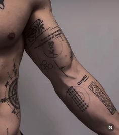 a man's arm with tattoos on it