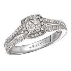 a white gold engagement ring with diamonds on it