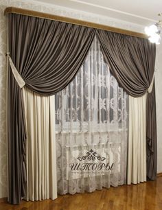 a living room with wooden floors and curtains