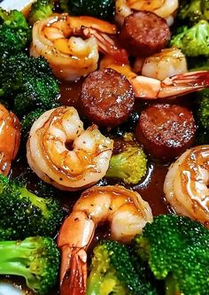 shrimp, broccoli and sausage stir - fry on a plate with brown sauce