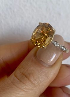 Metal: 14kt Yellow Gold Weight Of Ring Including Stones: 2.97 grams Stone: Citrine And Diamond Shape: Round And Oval-shape Diamond Weight: .09 ctw Citrine Weight: 4.50 ctw Measurements Of Citrine: 12 x 10 mm Ring Size: 6 Hight Of Ring: 27.00mm Width Of Band: 3.00 mm Design Element: Vintage infinity design. 1/2 Way Matching Diamond Band Listing: https://www.etsy.com/listing/576467063/any-color-14k-gold-vintage-style-diamond?ga_search_query=infinity&ref=shop_items_search_11 Eternity Matching B Elegant Oval Yellow Topaz Ring, Elegant Yellow Oval Topaz Ring, Oval Citrine Diamond Ring For Wedding, Oval Solitaire Citrine Jewelry, Oval Citrine Solitaire Jewelry, Yellow Gold Citrine Oval Diamond Ring, Oval Citrine Diamond Ring In Yellow Gold, Oval Citrine Topaz Ring In White Gold, White Gold Oval Topaz Ring Fine Jewelry