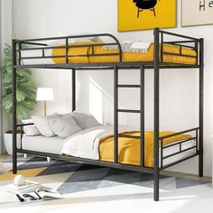 a black metal bunk bed with yellow sheets in a white and gray bedroom area next to a painting on the wall