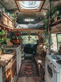 the interior of an rv with plants and rugs