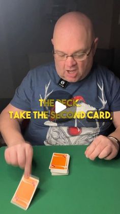 a man sitting at a table with two cards in front of him and the caption reads, take the second card