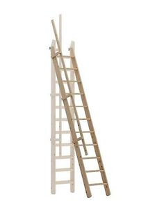 a wooden ladder leaning up against a white wall