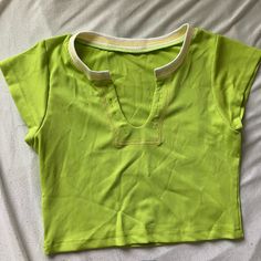 Neon Green Y2k Summer Crop Top Size: S Brand: N/A Color: Neon Green & White Condition: Nwot Brand New Never Worn Occasion/Style: Casual, Streetwear, Going Out, Summer, Vacation, Loungewear, Trendy, Preppy, Neon, Y2k, Colorful, Rave Fit: Slim Fit, Ribbed Material, V-Neck Plunge, Short Sleeves, Cropped Material: 95% Polyester, 5% Spandex Measurements: Pit To Pit: 13.5 Inches Shoulder To Shoulder: 12 Inches V-Neck Plunge: 4.5 Inches Waist: 12.5 Inches Length From Neckline: 7.25 Inches Trendy Green Cropped T-shirt For Summer, Green Cropped T-shirt For Summer Streetwear, Green Graphic Print Short Sleeve Crop Top, Y2k Summer Cropped T-shirt, Neon Green Crop Top, Rave Fit, Y2k Summer, Summer Crop Tops, Going Out