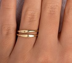 ✦ 14K Gold Dainty Signet Ring ✦ 14K Gold Dainty Signet Ring/ Tiny Signet Initial Ring/ Everyday Personalized Engraved Signet Ring/ Signet Letter Ring / Monogram Ring ✧ DESCRIPTION & DETAILS ✦ Made to Order ✦ Solid Gold Underside ✦ Certificate of Authenticity ✦ 14K Solid Gold / 585 stamp ✦ Band With: 1.70mm to 3.20mm ✦ Band Thickness: 1.50mm to 1.70mm ✦ Font: Arial ✦ Handmade. ✦ Fits one uppercase letter. ✦ Engraved. ✧ MATERIALS Solid gold pieces are made to last forever. Since gold is one of Anniversary Stackable Open Rings In Recycled Gold, 14k Gold Wedding Ring As Gift, Gold Stackable Bypass Ring As A Gift, Gold Stackable Bypass Ring For Promise, Gold Bypass Ring As A Gift, Stackable Recycled Gold Rings For Anniversary, Heirloom Gold Snake Ring For Promise, Yellow Gold Stackable Initial Ring In Fine Jewelry Style, Gold Bypass Ring For Anniversary With Open Band