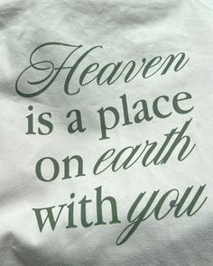 a white t - shirt with the words heaven is a place on earth with you