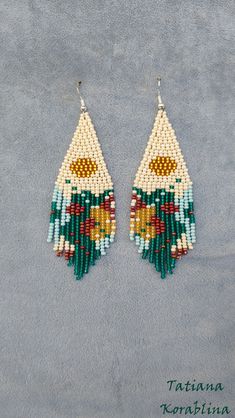 the earrings are made with seed beads and beading, which have been handmade