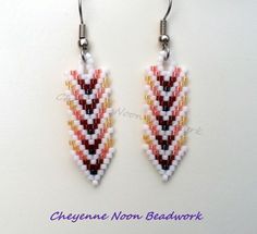 the beaded earrings are designed to look like an arrow