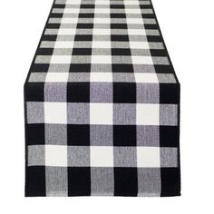 a black and white checkered table runner