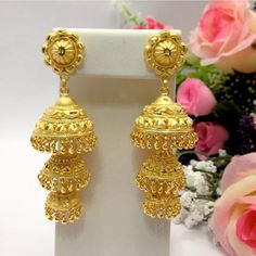 "Handmade Jhumka Earrings 22ct Micro Gold Plated Earrings Indian jewelry Pakistan Jewelry  Length:2.8\"Inches Approx  Traditional Indian Wedding Jewellery Slight Colour variations possible due to difference in screen and photograph  It is a perfect match with formal attire on special occasions or with casual wearing Care instructions Keep Jewellery away from direct heat, water, perfumes, deodorants and other strong chemicals as they may react with the metal or plating. The plating composition of Jewellery is as such that  perspiration (sweat) will not damage it. Wipe Jewellery gently with chamois cloth or leather swatch after every use. Wiping the jewellery with a soft cloth after removing the jewellery would add to its life. Avoid water  exposure for all jewelry  Thank You For Visiting" 22k Gold Earrings For Navratri Celebration, Gold-plated Danglers For Puja During Diwali, Gold Chandbali Danglers For Puja, 22k Gold Dangle Jhumkas For Festivals, Bollywood Yellow Gold Earrings For Puja, Bollywood Style Yellow Gold Earrings For Puja, Bollywood Style Yellow Gold Earrings For Navratri, 22k Gold Bollywood Danglers For Diwali, 22k Gold Danglers For Diwali Celebration