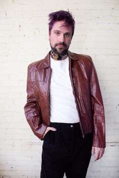 "This 1970s oxblood genuine leather motorcycle jacket is faux fur lined. Cropped coat wtih shoulder pads and two exterior pockets/one interior pocket. Front zipper and snap closure, adjustable hip snaps on back of jacket. Marked mens size 44. Maker: Bermans | Material: 100% genuine leather / faux fur lining CONDITION: very good to excellent condition with no flaws of note.  Small-medium | Measurements (taken flat): 20\" Shoulder to shoulder / 24\" Bust / 20\" Hips / 26\" Length / 28\" Sleeve len Retro Brown Biker Jacket With Pockets, Fitted Vintage Brown Retro Leather Jacket, Fitted Retro Vintage Brown Leather Jacket, Retro Vintage Brown Biker Jacket For Fall, Vintage Brown Retro Leather Jacket For Winter, Brown Leather Coat, Fall Winter Coat, Coat Spring, Oxblood Leather