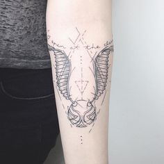 a woman's arm with a tattoo on it and an arrow in the middle