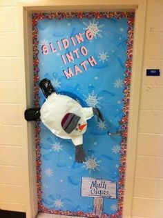 a door decorated to look like a snowman with the words sliding into math on it