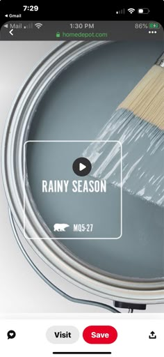 a paint can with a brush on it and the words rainy season written in white