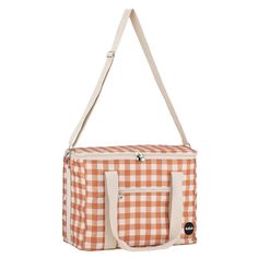 an orange and white checkered tote bag with straps on the front, hanging from a