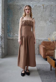 Brown Linen Dress with Yoke Cottagecore Dress Gorgeous Maxi Summer Dress for Women Western Linen Dress Romantic Spaghetti Dress Boho Hippie Boho & hippie maxi dress in beautiful brown color. Romantic dress with an original curly yoke and spaghetti straps are tied in a bow on the shoulders. Western linen dress with a ruffle on the bust. Bust detail are made in two layers. Side zipper.  Occasions: daily, vacation, wedding, casual, outdoor, holiday, party, evening.  Composition: 30% linen, 70% Viscose. Fabric with great properties for the summer season. Pleasant to the touch and breathing material. Floral dress colors: Brown - Brown Western & cowboy dress - Yoke dress - Fit and flare maxi dress - Double layer bust detail - Spaghetti dress Size on model XS Measurements: lenght from neck to hem Solid Dress With Ruched Bodice And Square Neck, Solid Color Dress With Ruched Bodice And Square Neck, Solid Square Neck Dress With Ruched Bodice, Brown Sundress With Adjustable Straps, Daywear Dress With Ruched Bodice And Straight Neckline, Daywear Dress With Fitted Bodice And Spaghetti Straps, Beige Dress With Ruched Bodice And Spaghetti Straps, Beige Spaghetti Strap Dress With Ruched Bodice, Brown Sleeveless Dress With Ruched Bodice