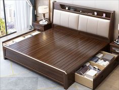 a bed with drawers underneath it in a bedroom