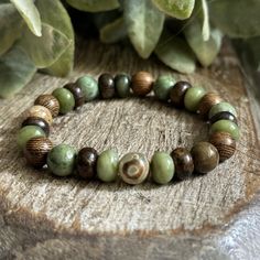 June's bracelet is here!
Abundant Earth. Designed with 8mm natural gemstones. Each piece, handmade. 
☀️ Enjoy 25% Off June's bracelet for a limited time. Available in sizes 6 1/4" through 9 1/4". 

"I firmly believe that nature brings solace in all troubles." ~ Anne Frank
~ Serpentine ~ Bronzite ~ Green Opal ~ Robles Wood ~ DZI Evil Eye Agate Green Bohemian Stretch Bracelet For Everyday Wear, Earthy Green Beaded Bracelets For Everyday, Earthy Natural Stone Bracelets For Gifts, Nature-inspired Beaded Bracelets For Healing, Rustic Green Adjustable Bracelet, Adjustable Rustic Green Bracelets, Earthy Gemstone Beads Bracelets For Meditation, Earthy Green Jewelry With 8mm Beads, Adjustable Rustic Green Bracelet