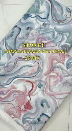 a tie with an abstract design on it and the words sydney sherbi silk rotary