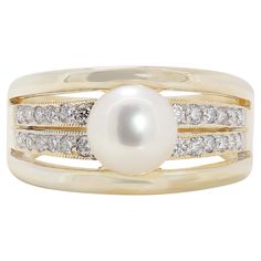 This exquisite 18K yellow gold ring showcases a lustrous 7.06MM Akoya pearl with a beautiful pink white hue. Surrounding the central pearl are 24 round brilliant diamonds, boasting a total carat weight of 0.29ct, F color grade, and VS clarity, adding a sparkling accent to the elegant design. Weighing 7.03 grams, this luxurious ring is sized at 53.5/14.5. A perfect blend of classic beauty and modern sophistication, this ring is a stunning addition to any fine jewelry collection. Metal: 18K Yellow Luxury Modern Yellow Gold Pearl Ring, Luxury Yellow Gold Akoya Pearl Rings, Elegant Yellow Gold Multi-stone Pearl Ring, Luxury Yellow Gold Pearl Ring Hallmarked, Luxury Yellow Gold Pearl Ring With Polished Finish, Akoya Pearl Ring, Yellow Gold Diamond Ring, Natural Diamond Ring, Heart Shaped Rings