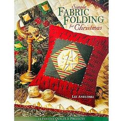 a book cover for simple fabric folding for christmas with a quilted pillow and candle holder