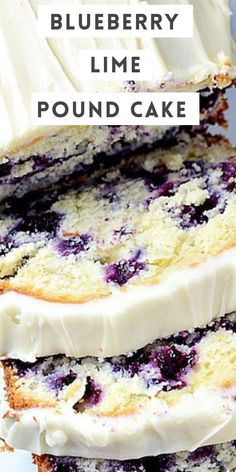 slices of cake with white frosting and blueberry toppings sitting on top of each other