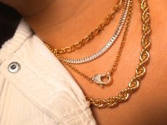 The necklace we’d wear on a summer vacay to Rio. This jumbo shimmery rope chain is sturdy and luxe and stands alone as a statement necklace or layered with our Bellini and Manhattan necklaces for some added glitz. 14k Gold Plated Brass Nickel + Lead Free Length: 16" or 18” Thickness: 7 mm Simple Chain Necklace, Simple Chain, Lock Necklace, Tennis Necklace, Rope Necklace, Bellini, Matching Bracelets, Gold Plated Chains, Gold Filled Jewelry