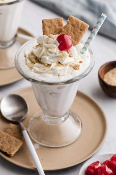 an ice cream sundae with cherries and graham crackers