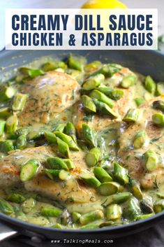 creamy dill sauce chicken and asparagus in a skillet with lemons on the side