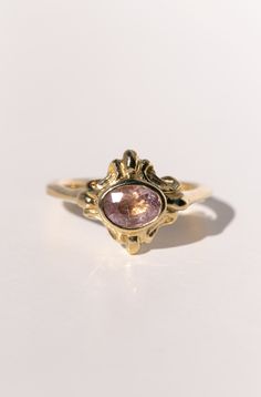 The Sainte ring is the "objet d’art" of the Paris collection - a term attributed to objects of artistic worth, detail, and beauty. This hand carved 18k gold ring has layers of details, with flourishes radiating from the center and wrapping around to the back. In the center is a .87ct mauve pink sapphire. Look closely into this one-of-a-kind gem and you'll see streaking inclusions that catch the light and shimmer in an incredibly unique way. The face of the ring spans 12mm x 14mm. Ready to ship a Scrap Material, Sustainable Fashion Brands, 18k Gold Ring, Mauve Pink, Recycled Gold, Wedding Things, Pink Sapphire, Leather Purses, Gold Ring