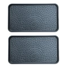 two black trays with leaves on the bottom and one has an empty tray for food