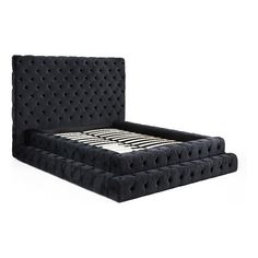 the bed frame is made up with black fabric and has buttons on each side,